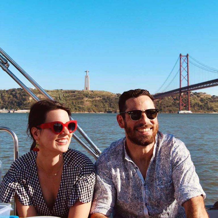 Daniela and Jorge on a boat on the Tagus River, Portugal