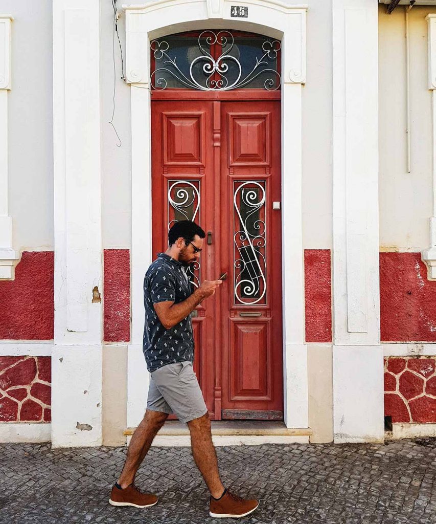 Man walking along the street in Faro, Portugal