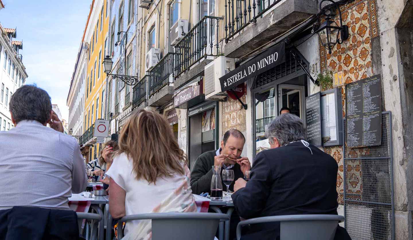 Workers enjoying lunch on a terrace in Lisbon, Portugal