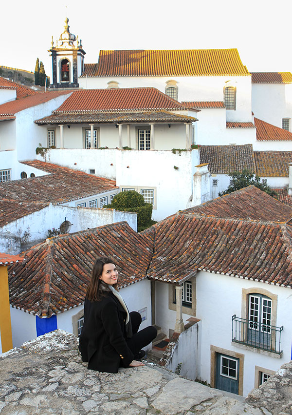 Standing on the town walls in Obidos, one of the most beautiful villages in Portugal