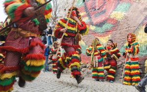 Caretos de Podence running through the streets during the Entrudo do Chocalheiro