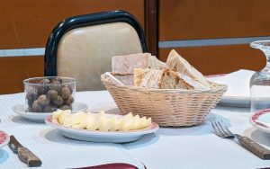 Bread, cheese and olives on the table at a Lisbon tasca