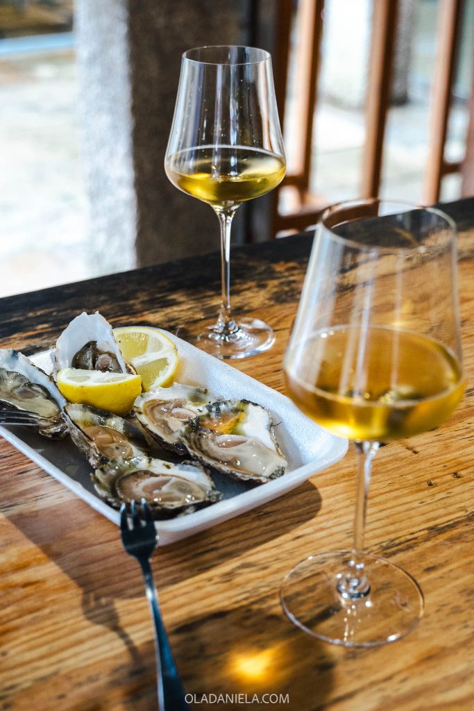 Oysters and white albarino wine at the Mercado Abastos in Santiago de Compostela