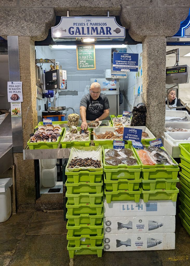 Fishmonger at the famous Abastos Markets in Santiago de Compostela, Galicia, Spain