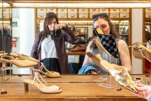 Selfie in the mirror of sapataria carmo shoe store in Lisbon